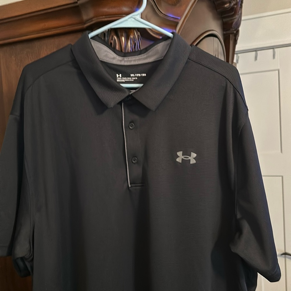 This is a black 3x under Armour polo shirt.